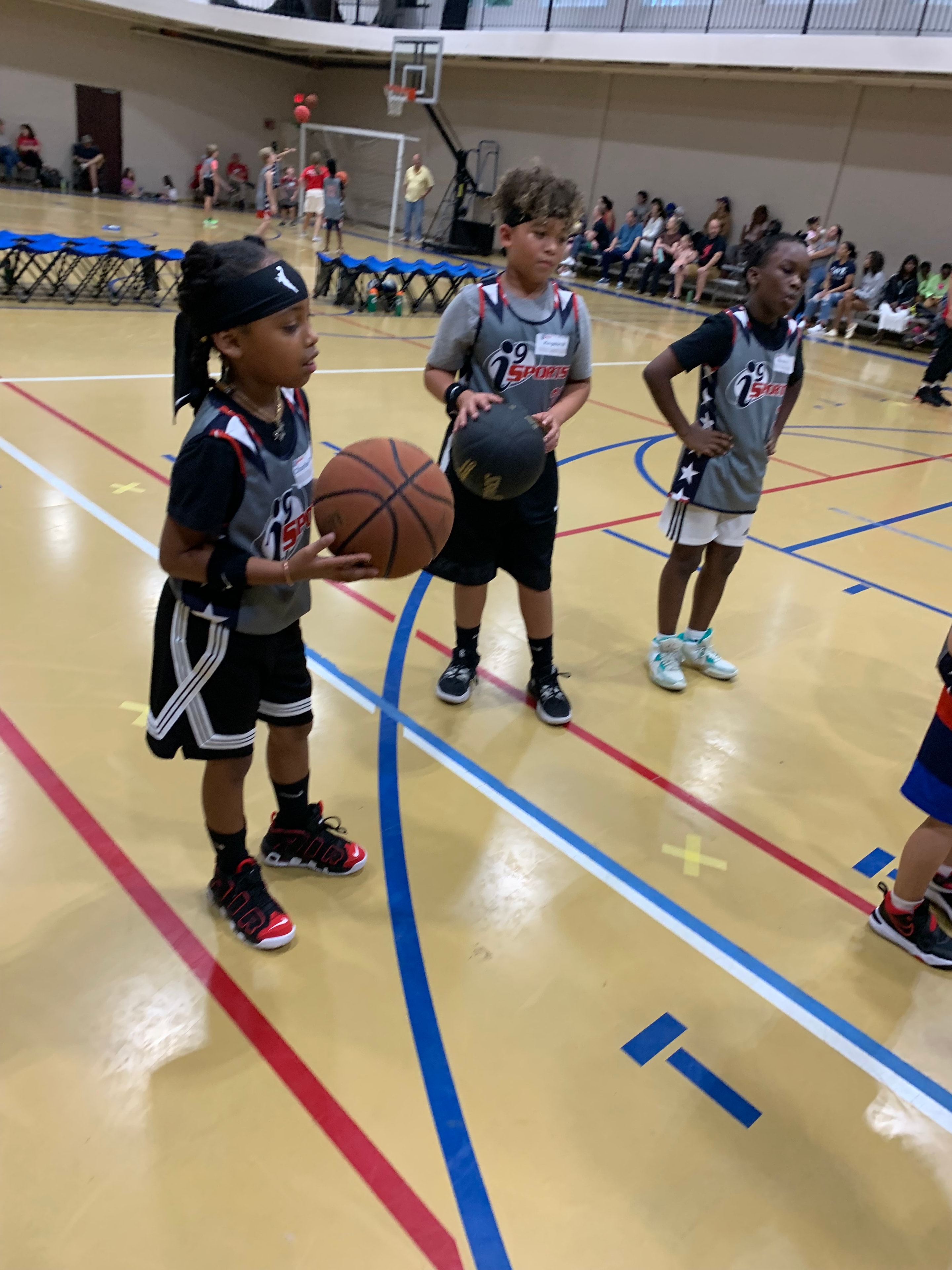 Youth basketball game action — i9 Sports program