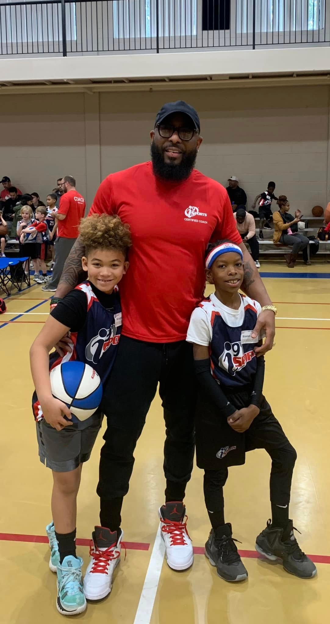 Jean-Paul Waterford with two youth basketball players — i9 Sports
