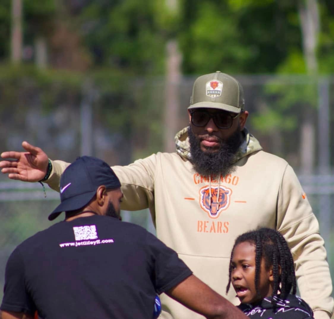 Jean-Paul Waterford in Chicago Bears hoodie directing players — Jett Life YFF